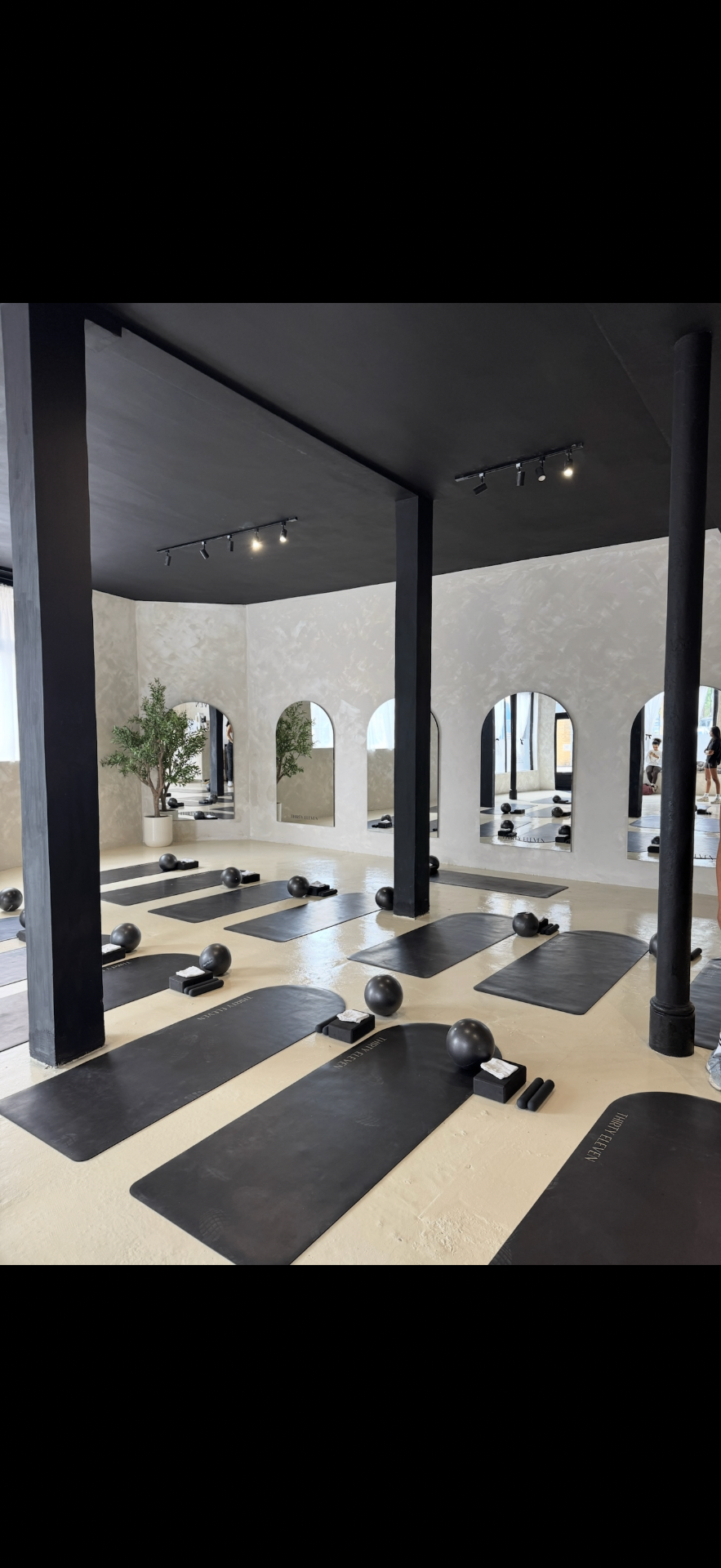 Thirty Eleven studio — mats, props and arched mirrors